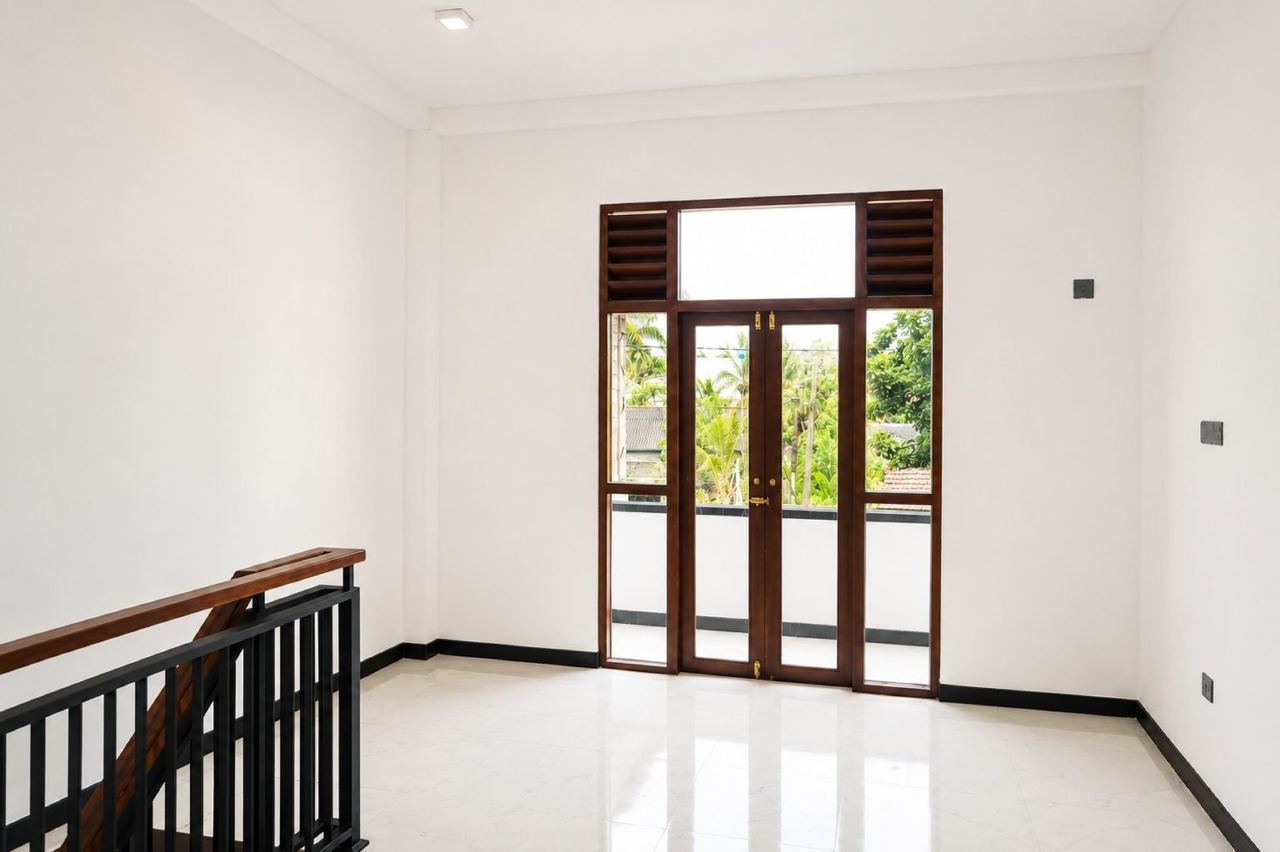 Bright minimal room with balcony view – Modern Two-Storey House for Sale in Kesbewa