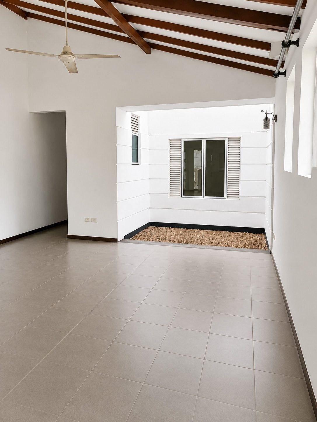 Bright minimalist courtyard interior – Three Houses on One Lot for Sale in Rajagiriya