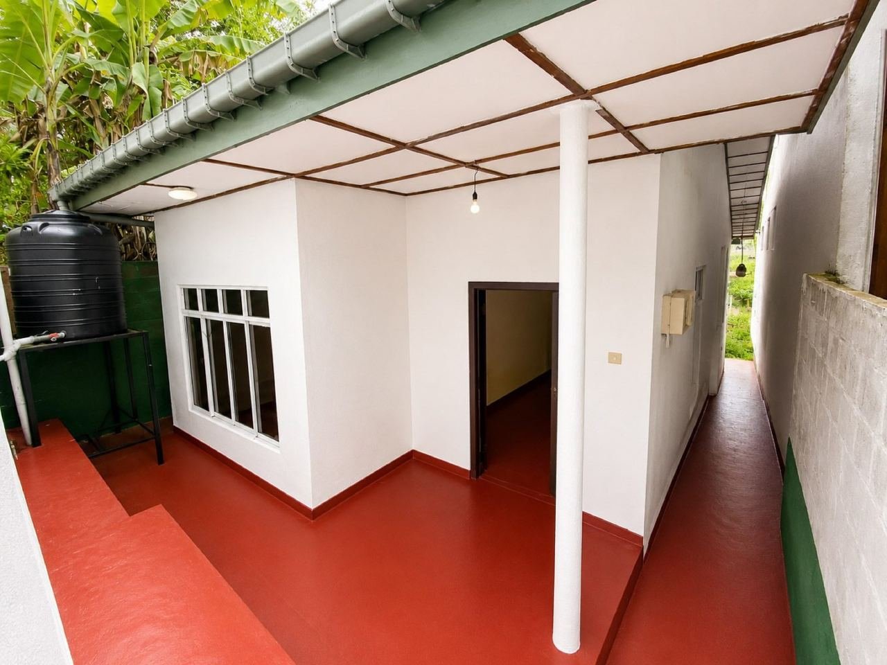 Freshly painted tropical patio passage – Three Houses on One Lot for Sale in Rajagiriya